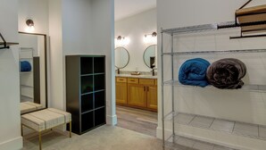 A bathroom with a bench, shelves, and a mirror. - Modern Fairview Retreat: Spacious Deck + Mtn View! (Fairview)