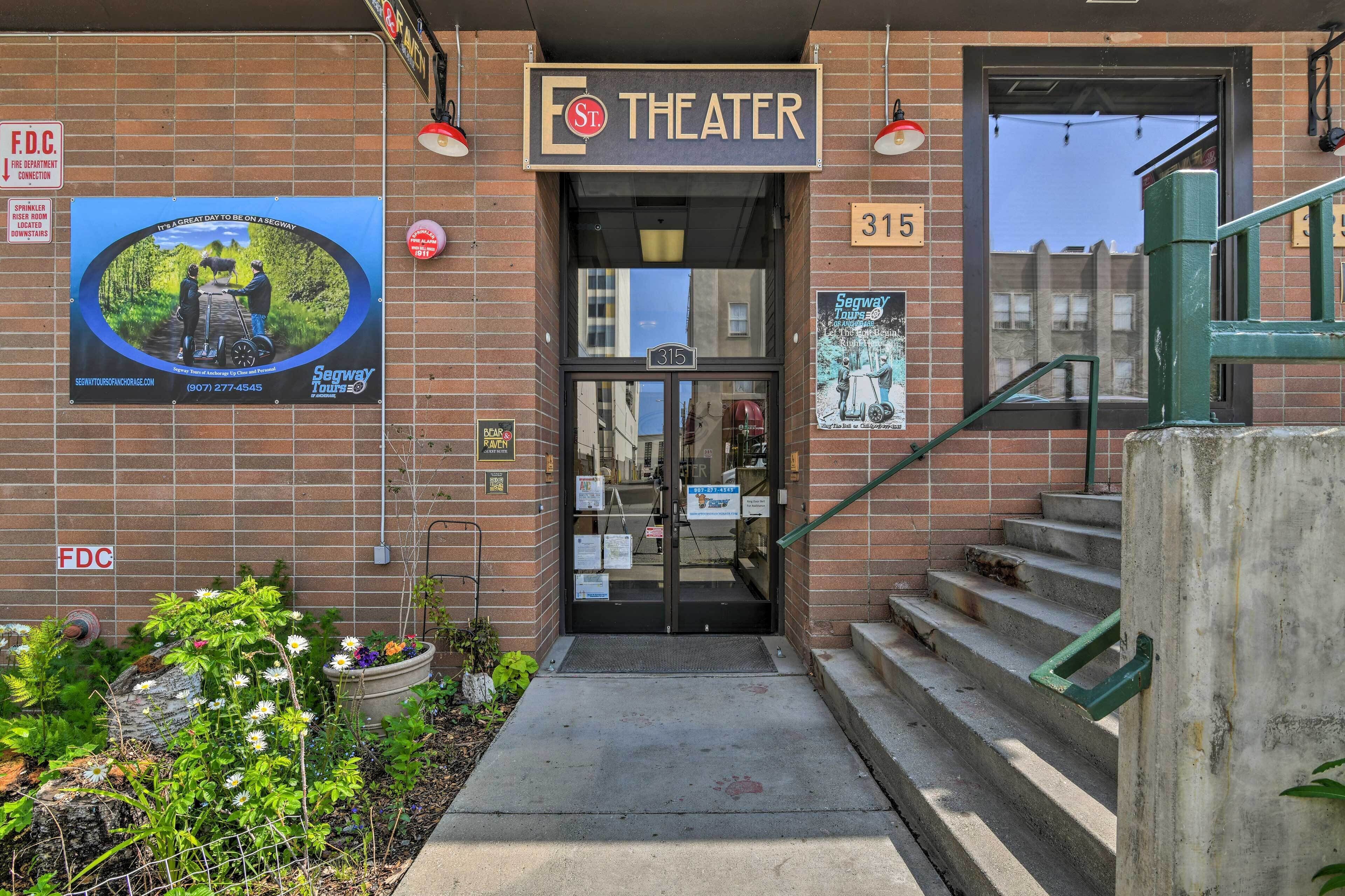 A theater entrance with a sign reading "THEATER" above the door, number 315, and a poster advertising "Segway Tours."