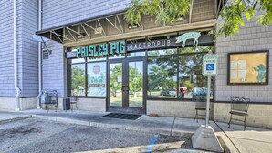 A gastropub named 'The Paisley Pig' with a sign indicating reserved parking for disabled individuals. - Grand Haven Condo w/ Patio < 1 Mi to Downtown (Grand Haven)