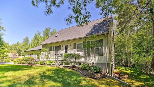 A two-story house with a front porch, a small garden, and a driveway. - Charming Owls Head Retreat: 2 Mi to Rockland Coast (Owls Head)