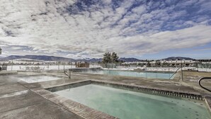 A pool area with multiple pools and a view of mountains in the background. - Townhome w/ Club Access on Shuttle Stop (Fraser)