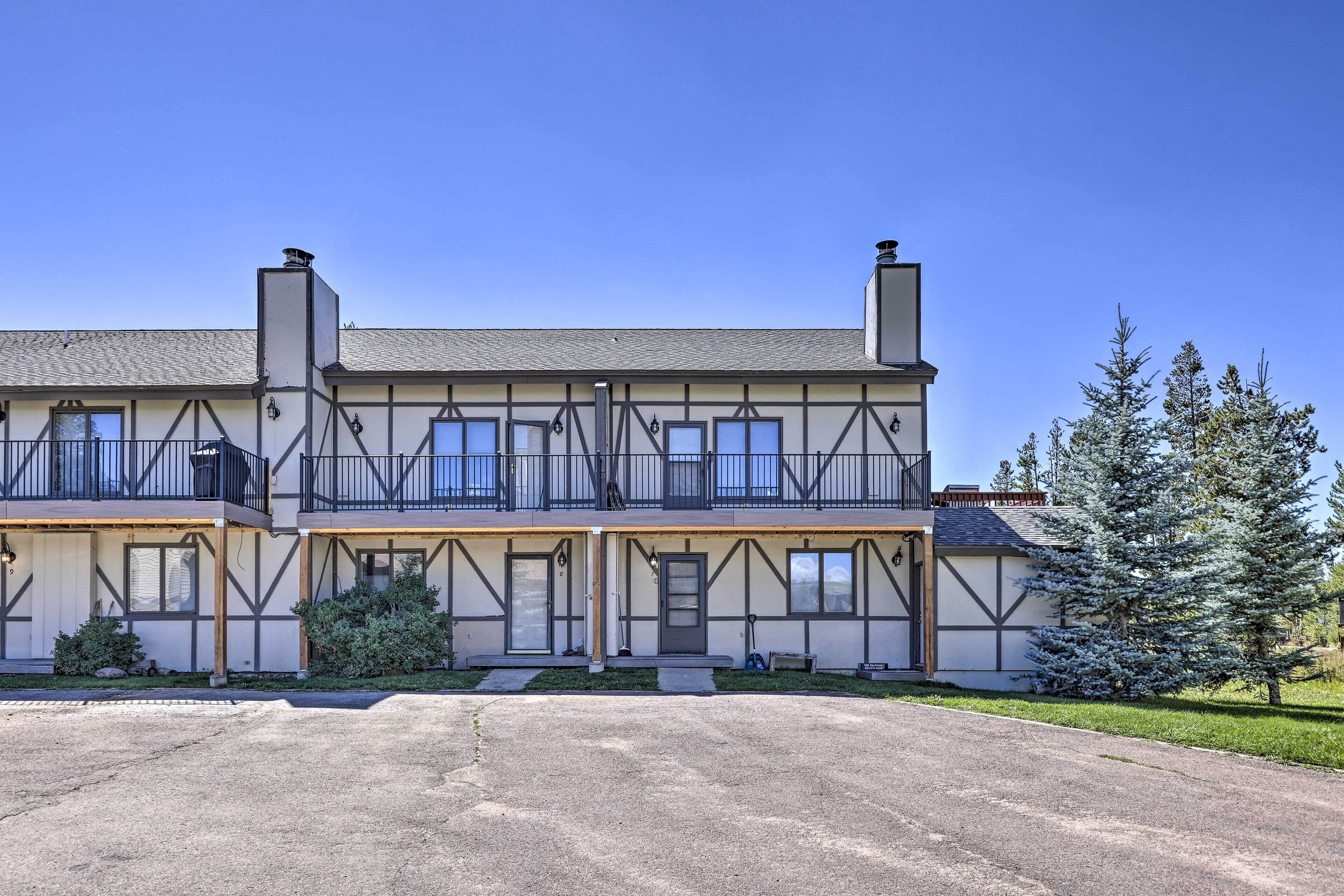 A two-story building with a symmetrical facade, multiple windows, and a central entrance.