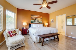 A bedroom with a bed, a bench, a chair, a nightstand, and a ceiling fan. - Superstition Mtn Views! Gold Canyon Gem w/ Hot Tub (Gold Canyon)