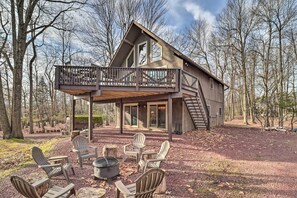 A cabin with a deck, outdoor seating, and a fire pit. - Lake Harmony Access: Home w/ Game Room + Fire Pit! (Lake Harmony)