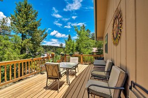 A wooden deck with outdoor furniture, a railing, and a view of trees and mountains. - Cabin w/ Deck 3 Mi to Ski Cloudcroft & Hiking (Cloudcroft)