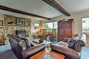 TV, fireplace, books - Secluded Mountain Home w/ Stunning Views & Deck! (Bryson City)