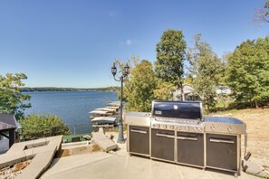 A waterfront outdoor grill with a view of the lake and boats. - Deck, Hot Tub, Views! Reunion Retreat in Ozarks (Linn Creek)