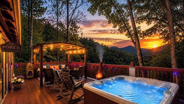 A wooden deck with a hot tub, outdoor seating, and a sign reading 'The Porch.' - Hot Tub Private Mtn-view Deck Family Cabin (Almond)