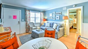 A cozy living room with a sofa, armchairs, a dining table, and a lamp. - Condo w/ Pool Access: Walk to Shopping & Beach! (Naples)