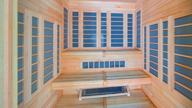 A sauna with wooden walls and benches.