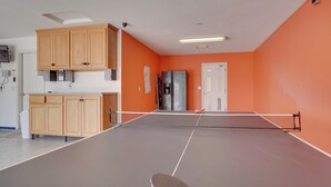 A room with a ping pong table, wooden cabinets, a refrigerator, and an orange wall. - Arizona Retreat w/ Casita ~ 2 Mi to Lake Havasu (Lake Havasu City)