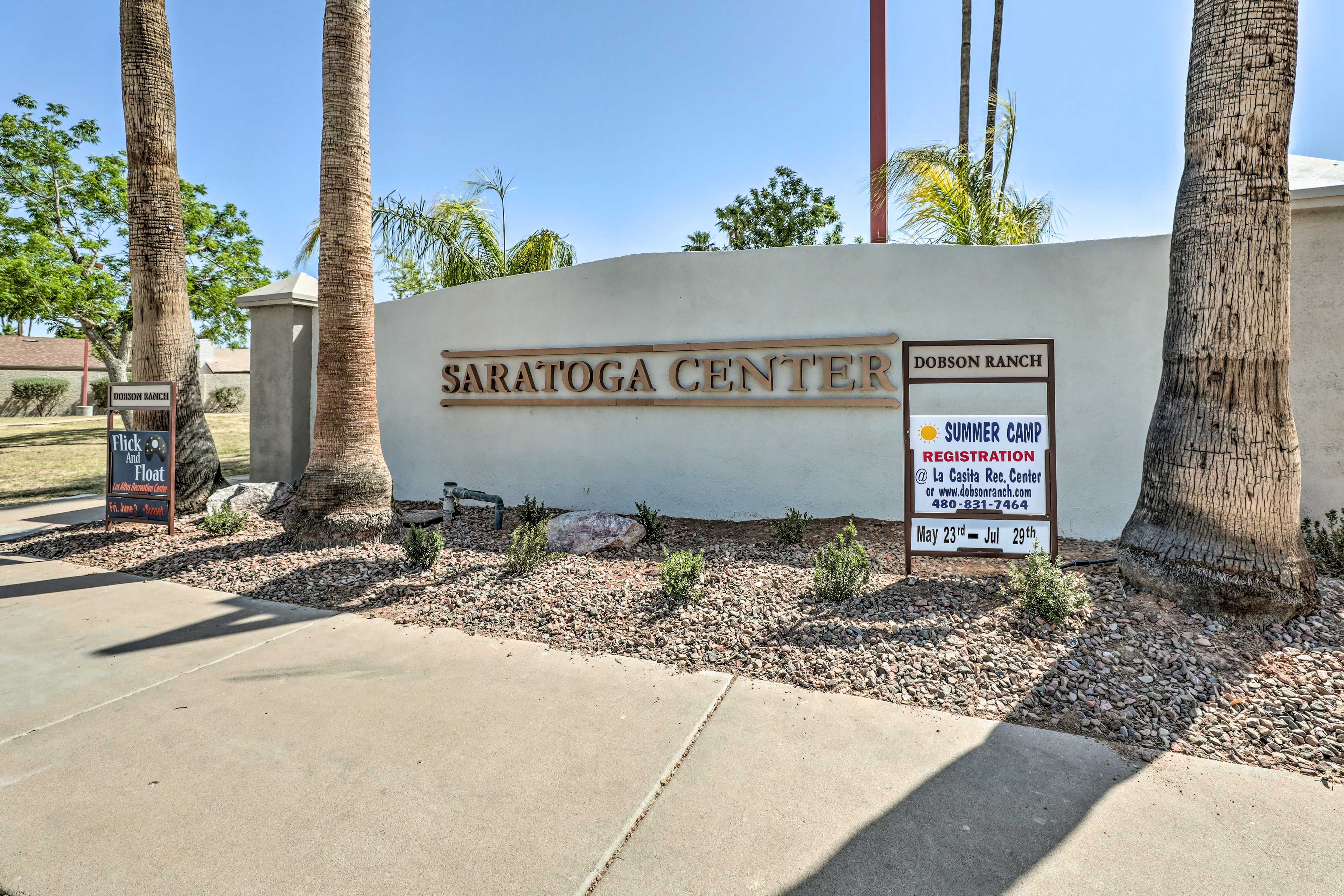 A sign for Saratoga Center with a registration notice for a summer camp.