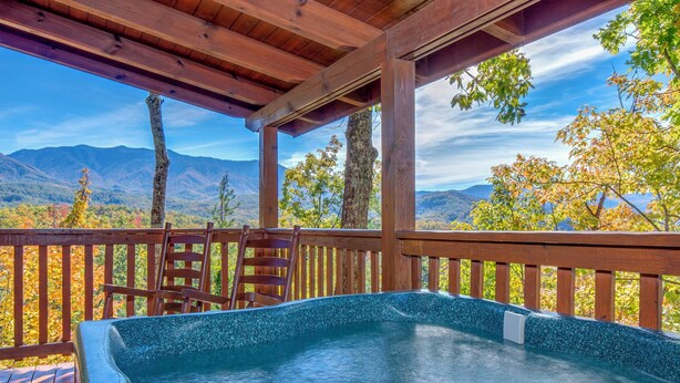 A hot tub under a wooden pergola with a mountain view. - Game Room & Hot Tub! Black Bear Falls Resort Cabin (Gatlinburg)