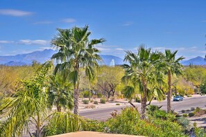 A road with palm trees and mountains in the background. - Cozy Fountain Hills Condo w/ Mountain Views! (Fountain Hills)