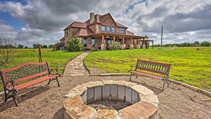 A large stone building with a stone fire pit and two benches in front. - Home w/ Game Room & Fireplace: 14 Mi to Mckinney! (Blue Ridge)