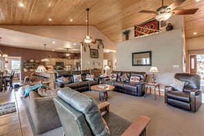 A spacious living room with leather furniture, a dining area, and a kitchen. - 19 Mi to Ski Apache! Cozy Ruidoso Digs Near Dtwn (Ruidoso)