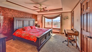 A bedroom with a large bed, a desk, and a ceiling fan. - 2 Mi to Hot Springs: Nathrop Gem w/ Fire Pit (Nathrop)
