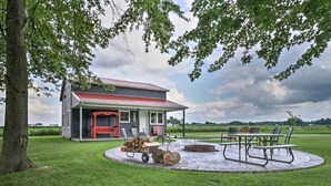 A house with a red roof and a porch with outdoor furniture. - Cozy Haven of Rest Home w/ Amish Country Views! (Shipshewana)