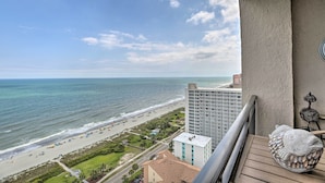 A balcony with a view of the beach and ocean. - Myrtle Beach Ocean-view Condo: Walk to Beach! (Myrtle Beach)