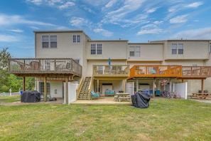 A multi-story residential building with a covered patio, outdoor seating, and bicycles. - Pool Access & Deck: Bethany Beach Gem (Ocean View)