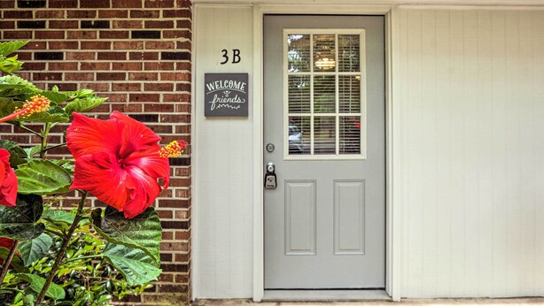 A house with a grey door, a 'WELCOME friends' sign, and a '3B' sign on the wall. - Cozy Studio With Yard, 6 Miles to Dwtn Beaufort! (Beaufort)