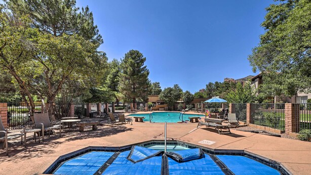 A swimming pool area with a hot tub, lounge chairs, and a covered seating area. - Mtn-view Condo w/ Hot Tub Access in Sedona! (Sedona)