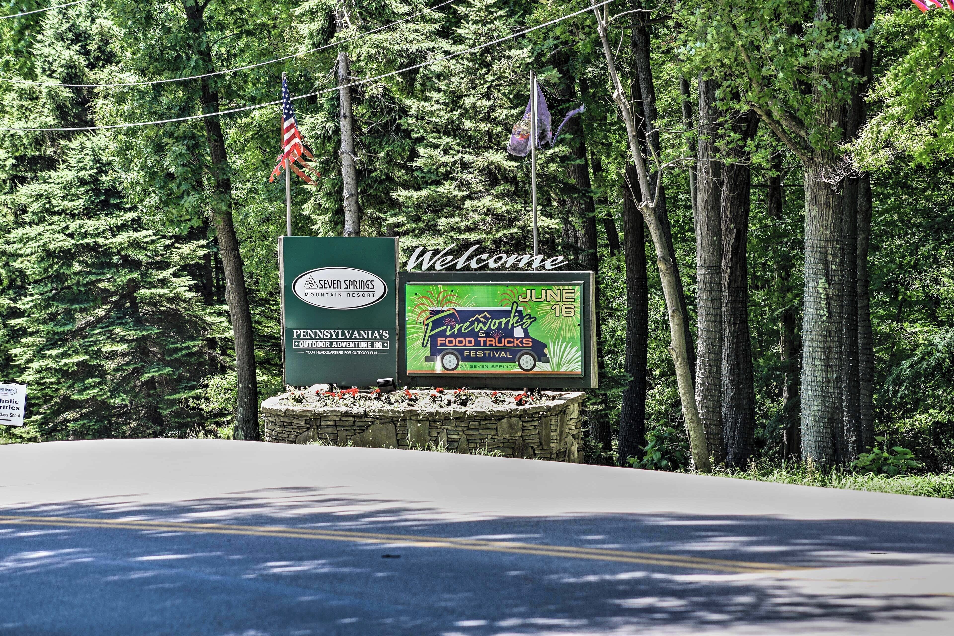A welcome sign for Seven Springs Mountain Resort with a 'Pennsylvania's Outdoor Adventure' and 'June 16' event.