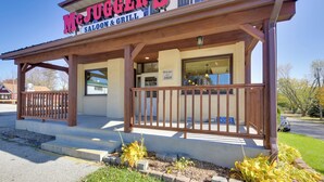 A McJuggler's Saloon & Grill with a wooden porch and a 'Welcome 1869' sign.