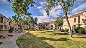 A residential area with multiple two-story houses, a curved pathway, and well-maintained lawns. - Balconies & Resort Amenities: Scottsdale Condo (Scottsdale)