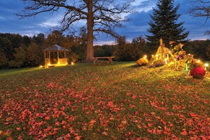 A gazebo, a picnic table, and a decorative display with lights in a grassy area. - Bungo Creek Retreat w/ Multi-use Trails & a Creek (Pine River)