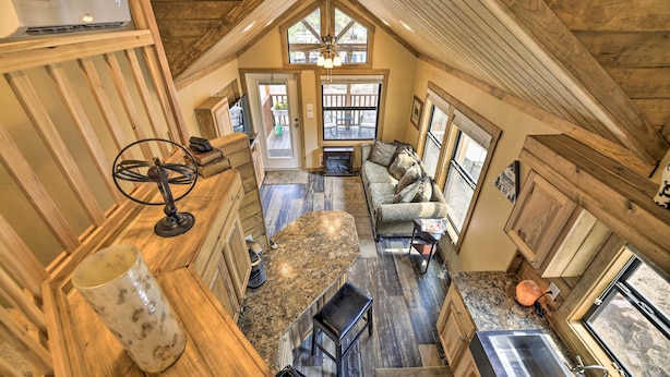 A spacious kitchen with a large island, wooden ceiling, and a view to the outside. - Pagosa Springs Tiny Cabin: Fish, Hike, Ski & Soak! (Pagosa Springs)