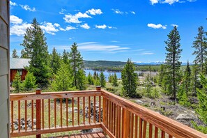 A wooden deck with a view of a lake, trees, and mountains in the distance. - 4 Mi to Rocky Moutain Nat'l Park: Grand Lake Home! (Grand Lake)