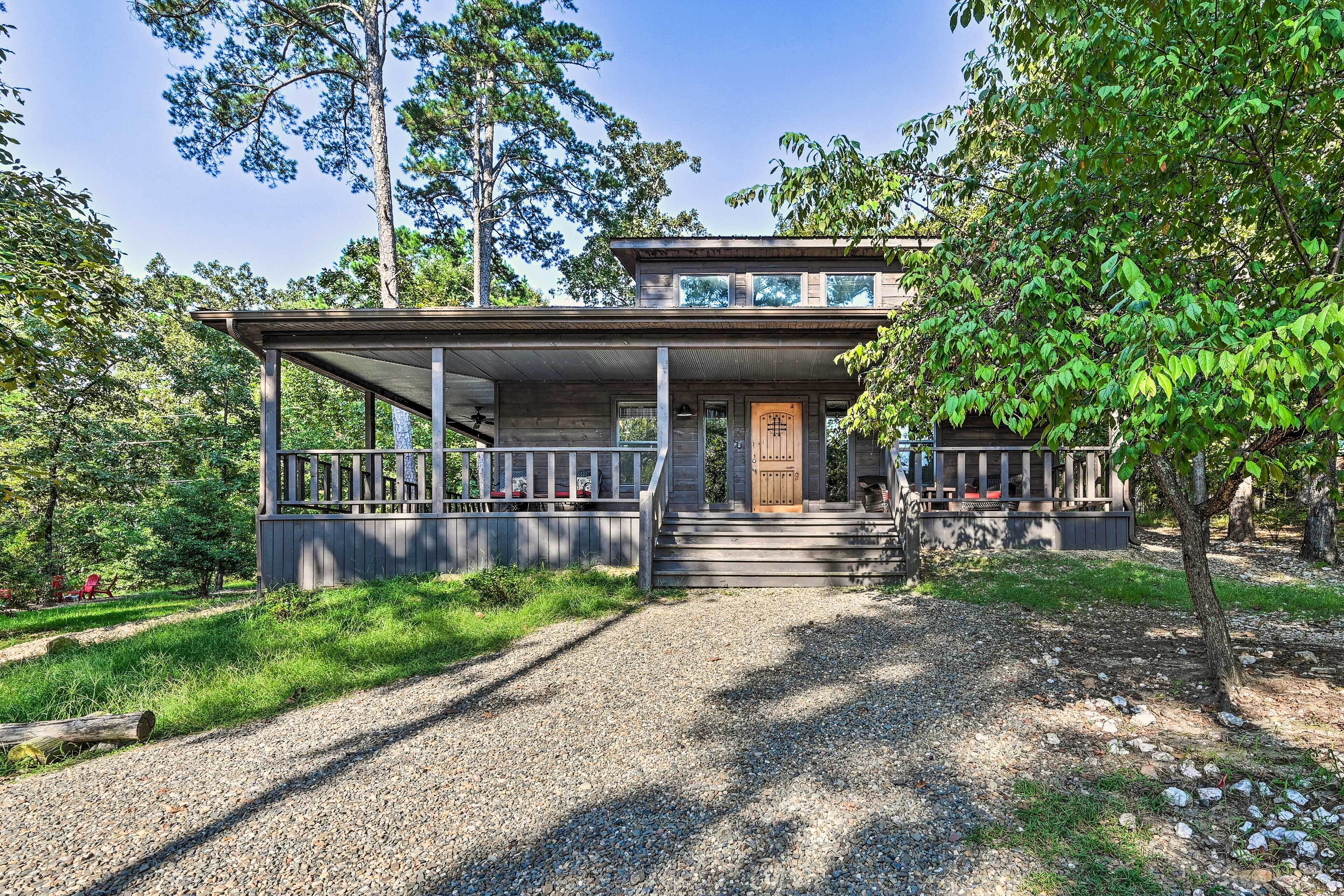 A two-story house with a porch and a wooden door.