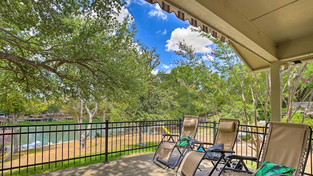A covered deck with outdoor furniture and a view of a lake. - Lake Placid Paradise w/ Dock, Grill & Kayaks! (Seguin)
