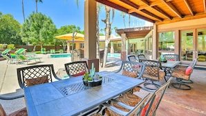 An outdoor patio area with a covered seating area, a pool, and a view of the surrounding landscape. - 2 Mi to Old Town: 'the Grand Palms Estate' w/ Pool (Scottsdale)