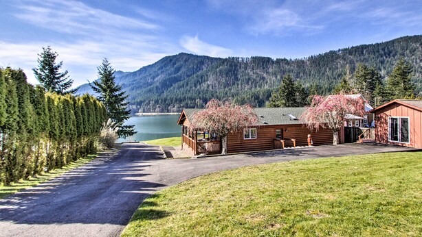 A cabin with a view of a lake and mountains. - Lakefront Eatonville Cabin w/ Dock & Mtn Views! (Eatonville)