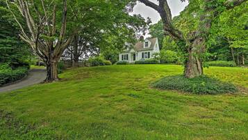 Experience a peaceful living environment in this serene residential setting surrounded by lush greenery and mature trees.