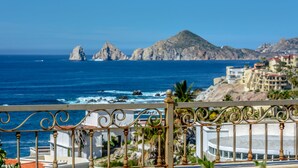 A coastal view with rocky formations and buildings in the background. - Cabo Hacienda w/ Private Pool & Rooftop Terrace! (Cabo San Lucas)