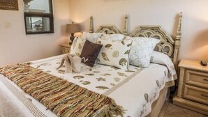 A bedroom with a bed, nightstands, a lamp, and a window. - Cabo Hacienda w/ Private Pool & Rooftop Terrace! (Cabo San Lucas)