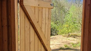 A wooden door with a heart-shaped window and a metal handle. - 4200ft Luxury Stargazing Glamping Haven, Ultra-Private, Near BRP (Maggie Valley)