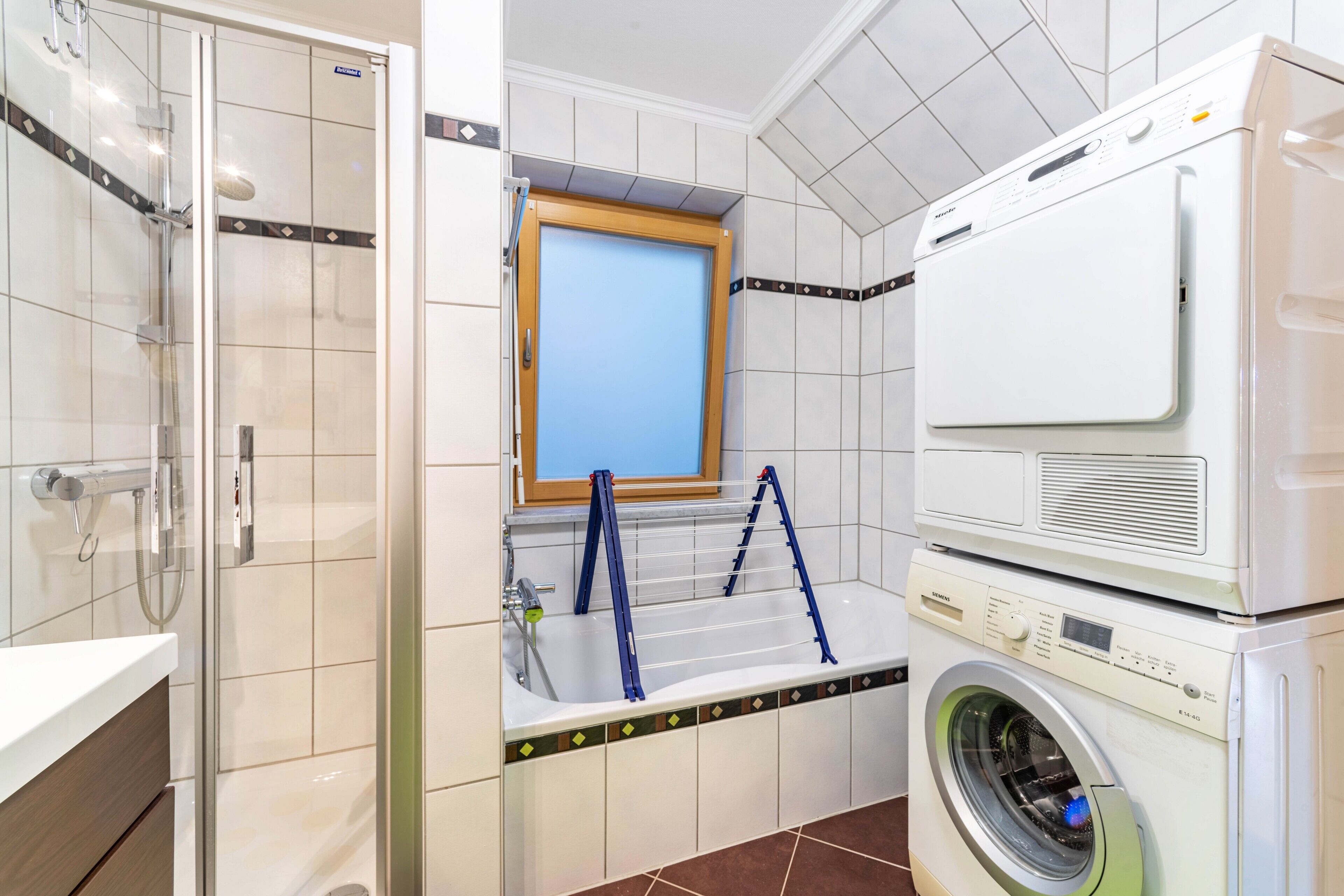 Bathtub, hair dryer, towels