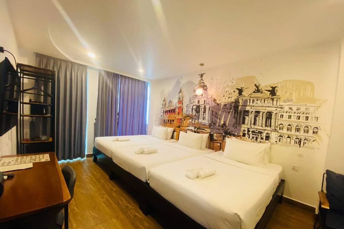 Deluxe Triple Room, Multiple Beds, Balcony, City View | 1 bedroom, in-room safe, individually decorated, desk