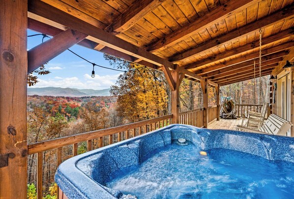 Relax in a hot tub surrounded by breathtaking mountain views.