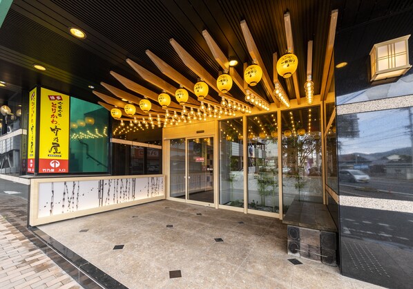 A modern building entrance with a wooden ceiling, glass doors, and a tiled floor. - HOTEL GRANDSPA AVENUE (Asakura)