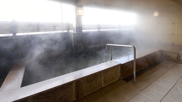 A steam room with a bench, a metal handrail, and a view of a bridge outside. - HOTEL GRANDSPA AVENUE (Asakura)