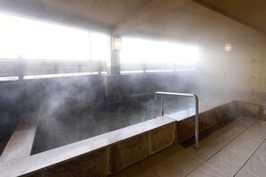 A steam room with a bench, a metal handrail, and a view of a bridge outside. - HOTEL GRANDSPA AVENUE (Asakura)