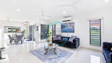 Luxury Townhome | Living area | 60-inch Smart TV with cable channels, TV, Netflix