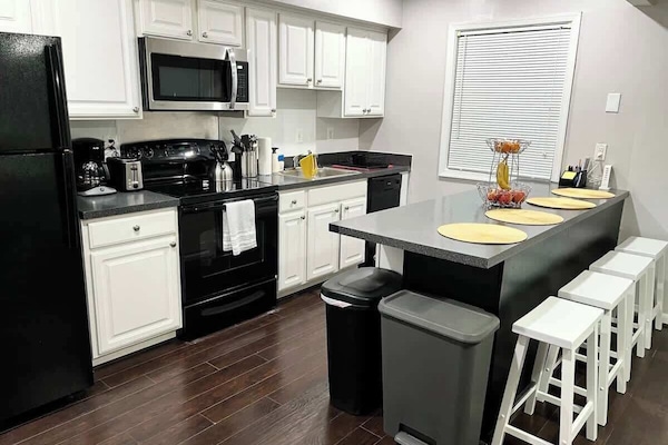 Enjoy making a meal in this fully equipped kitchen with a large island that seats 4