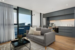 Apartamento exclusivo | Área de estar | TV de tela plana 40 polegadas com canais a cabo, TV