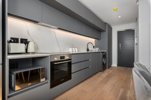 Exclusive Apartment | Private kitchen | Fridge, microwave, oven, stovetop - The Avant 303 (Cape Town)
